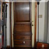 F113. Slant front secretary with wire facing.